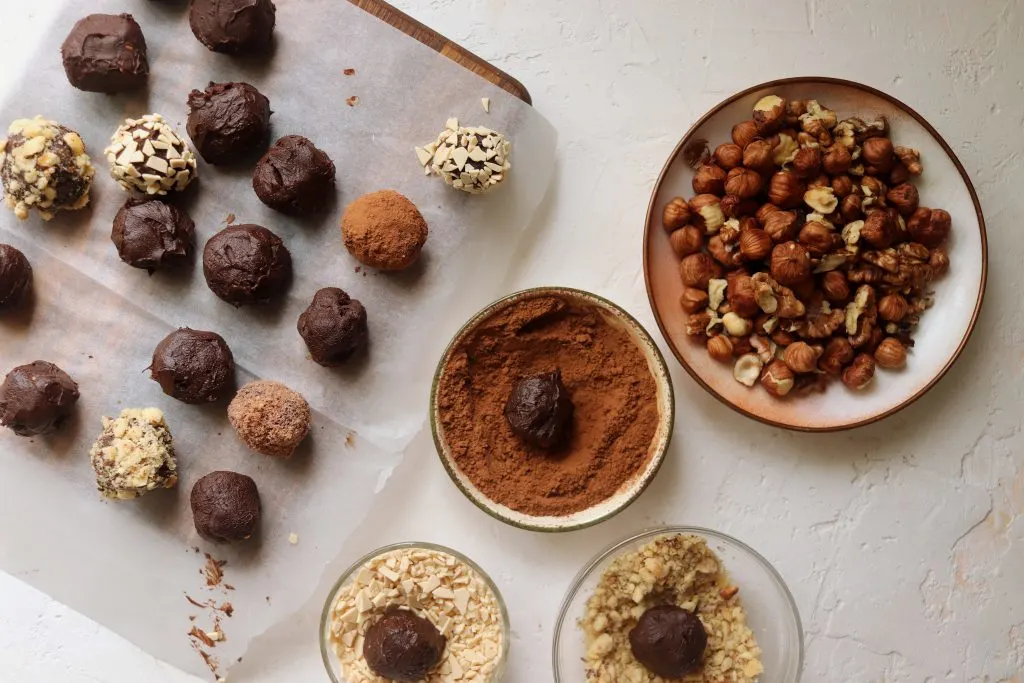 Formed and chilled balls of no-bake truffle recipe.