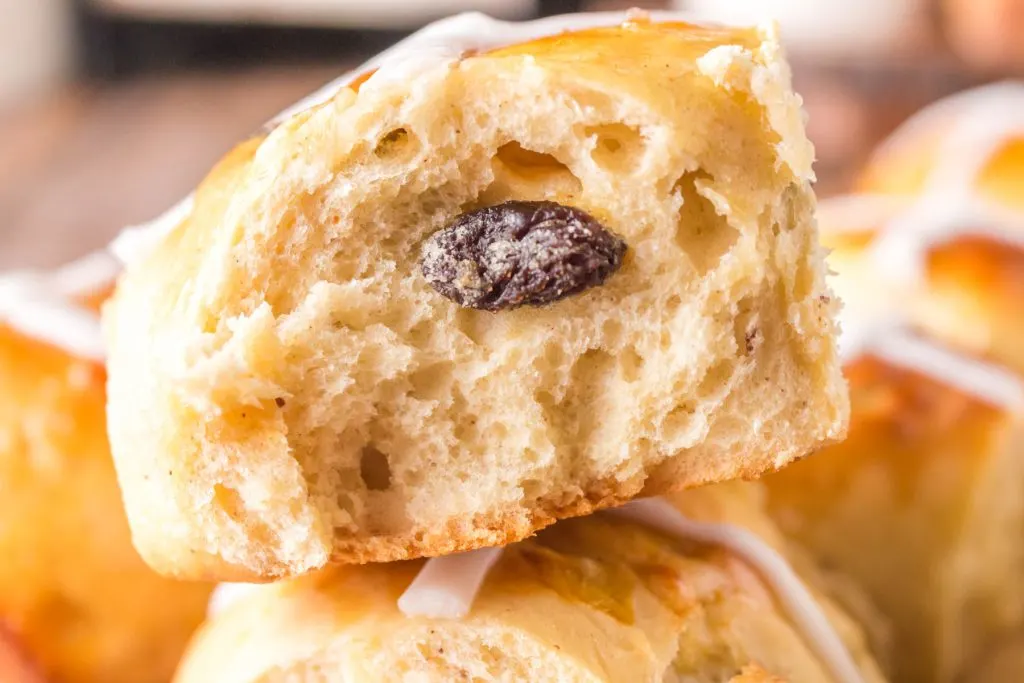 Close-up of the inside of a single hot cross bun.