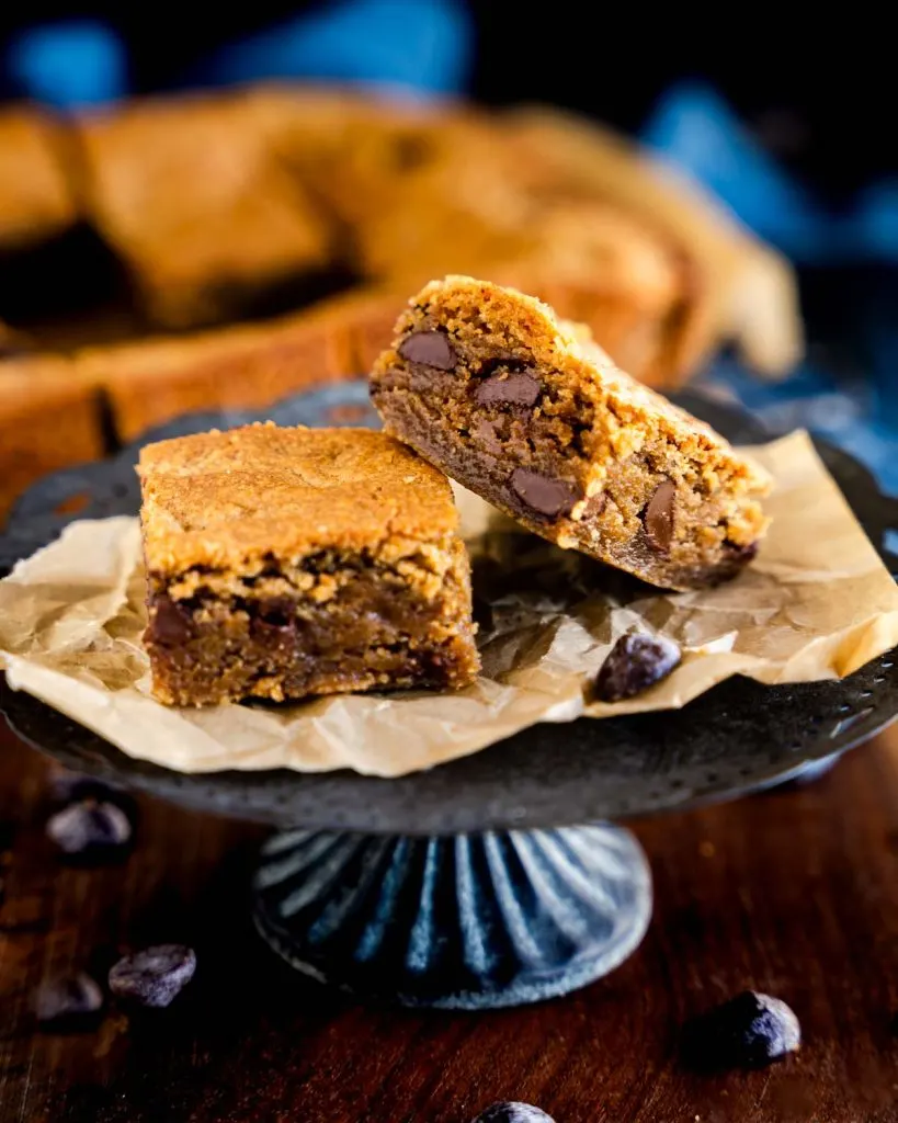 Peanut butter chocolate chip blondies on a platter.