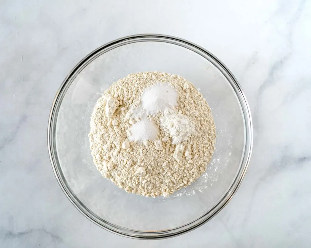 A bowl of flour with baking soda, cornstarch and salt added.