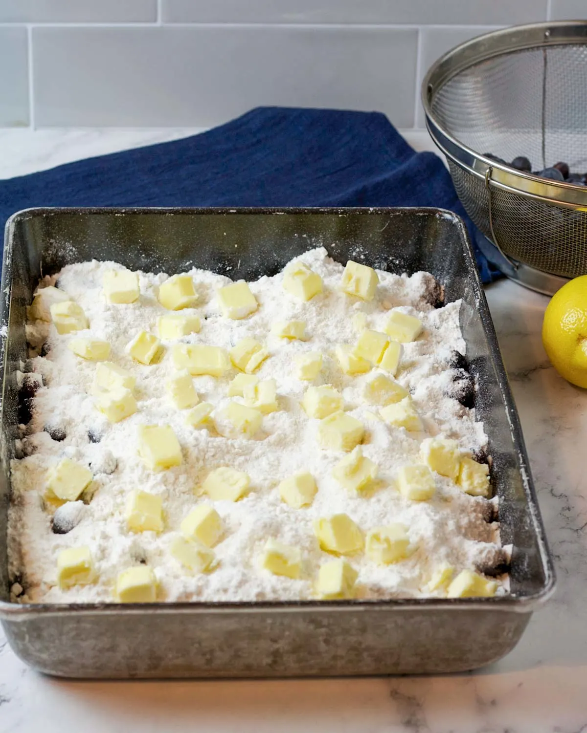 Place the butter evenly over the entire top of the dish.