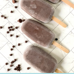 Top Down view of frozen chocolate fudge pops surrounded by chocolate chips