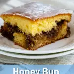 Side view of a slice of Honey Bun Cake showing a ribbon of cinnamon pecan filling.