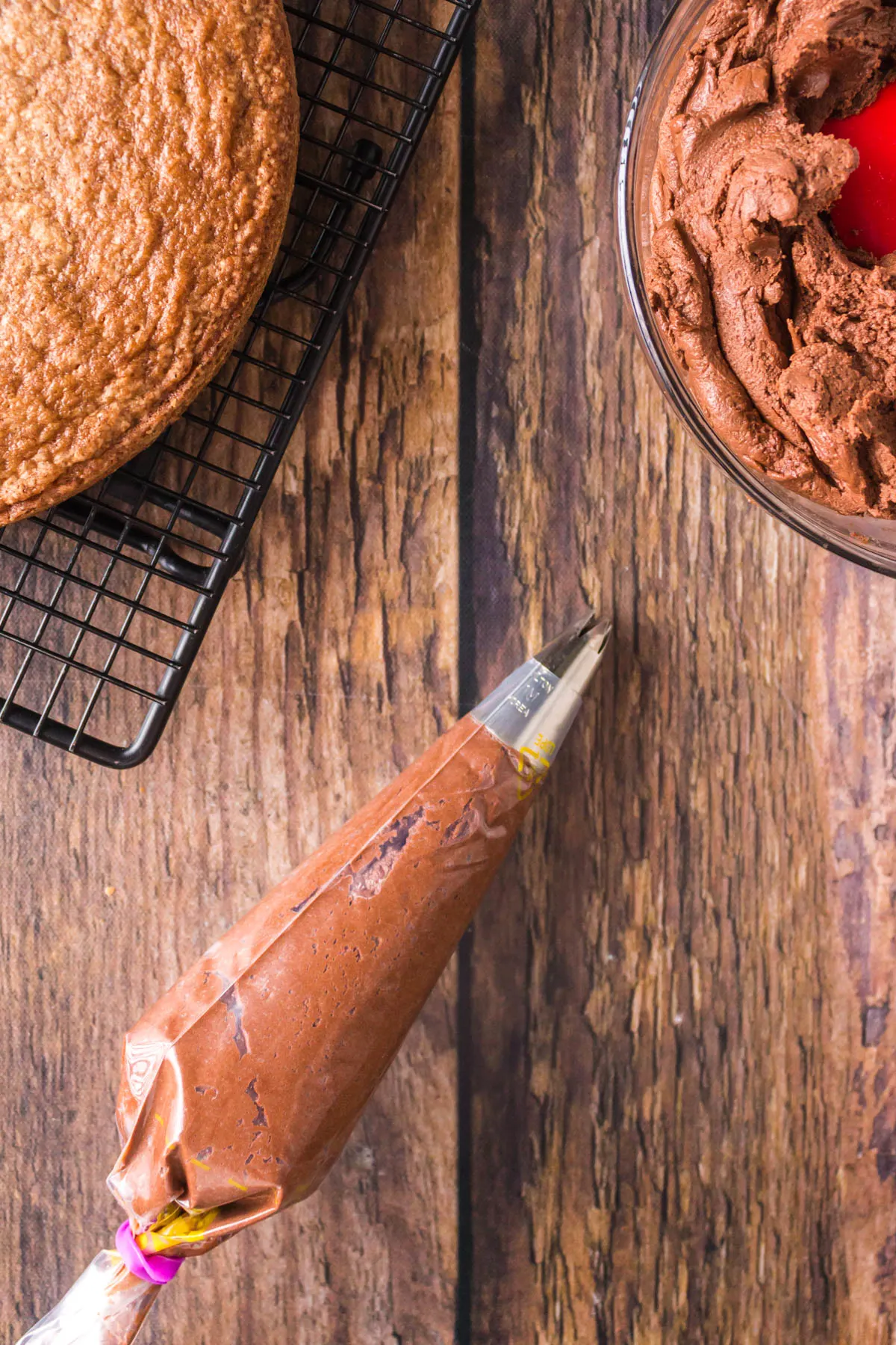 piping bag filled with easy chocolate buttercream frosting recipe.