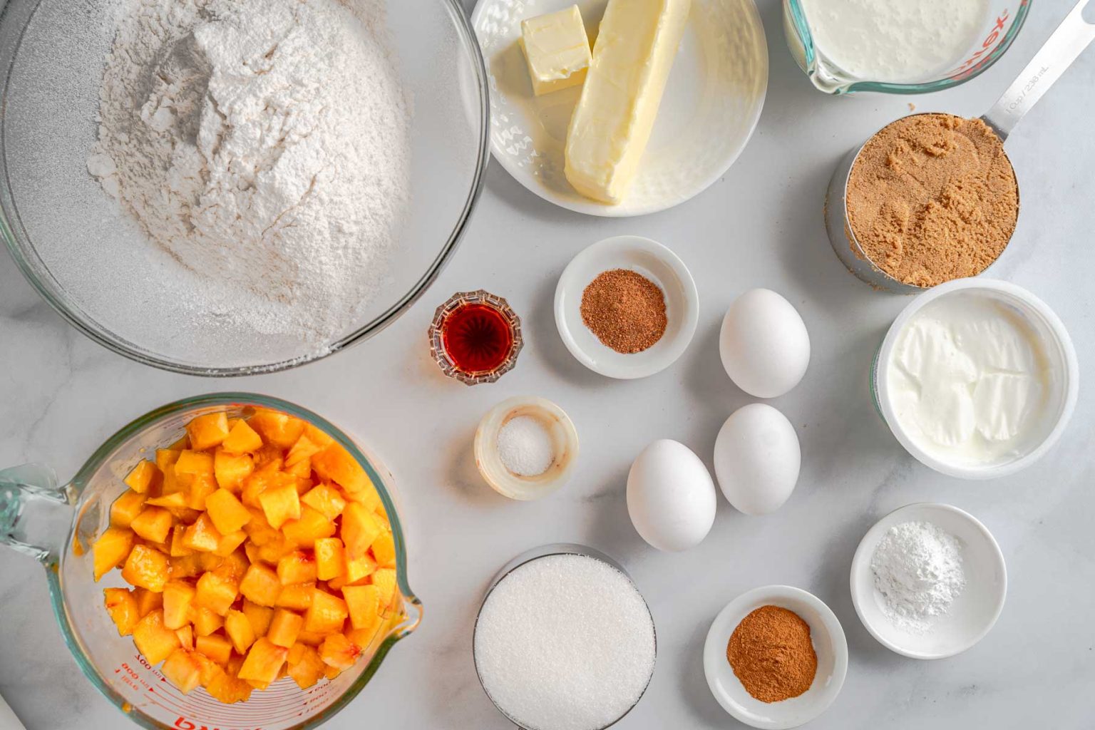 Ingredients: flour, butter, sugar, brown sugar, eggs, cinnamon, powdered sugar, peaches, vanilla, salt, baking powder, nutmeg, buttermilk, yogurt, shortening, cream, one vanilla bean.
