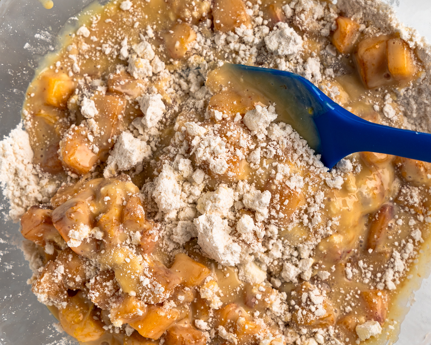 A gallery of 3 photos showing the steps to mix peach cobbler.