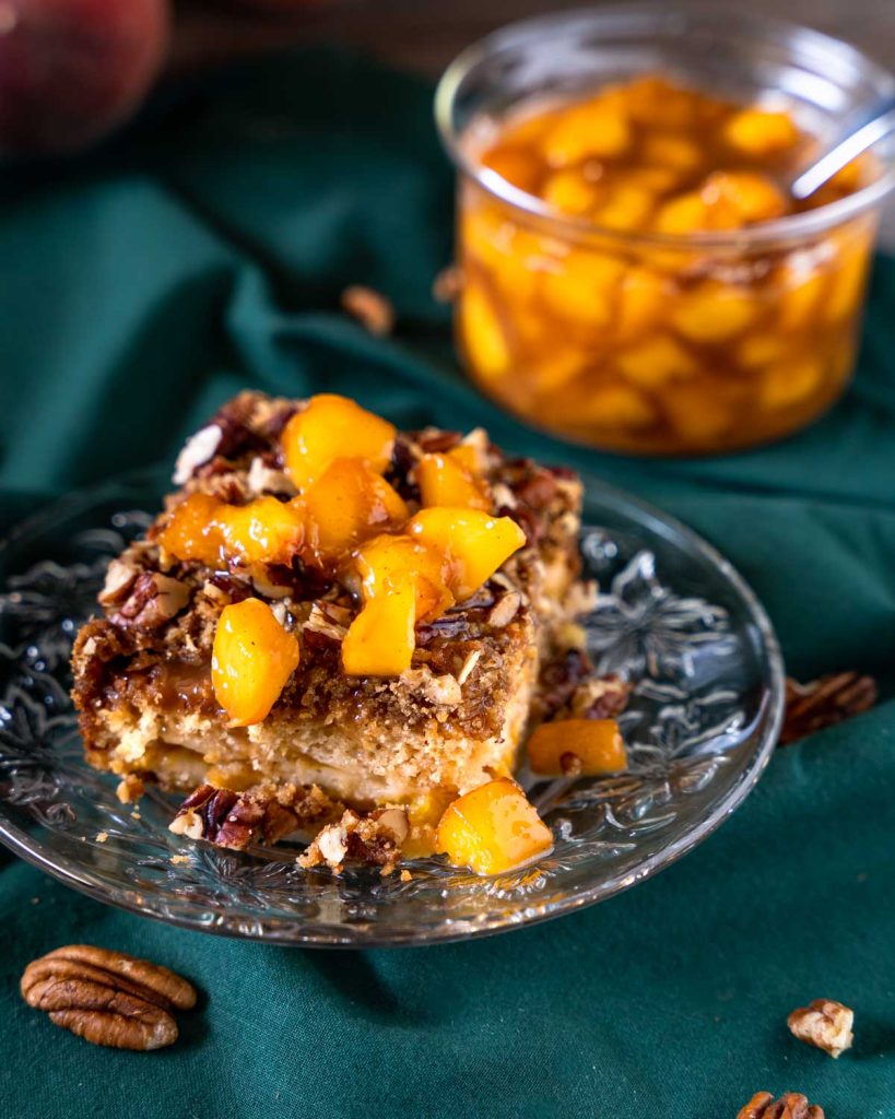Closeup of piece with bourbon sauce on top.