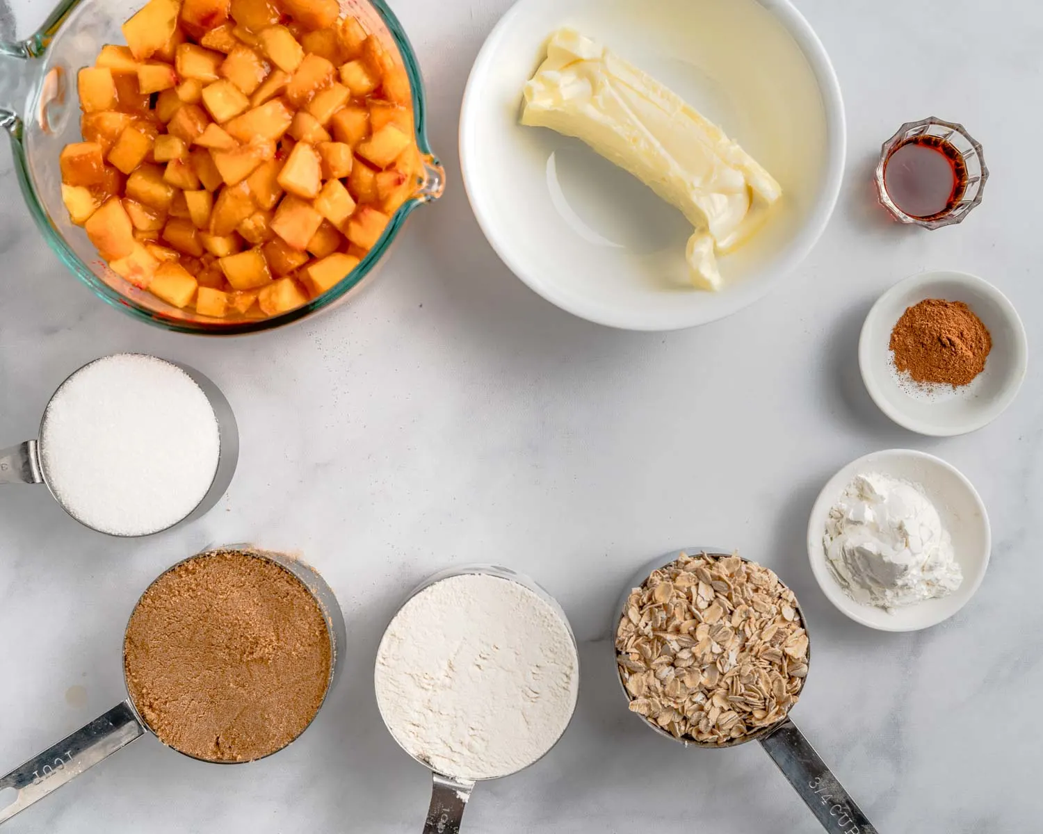 Ingredients: peaches, butter, sugar, cornstarch, water, vanilla, flour, oatmeal, brown sugar, and cinnamon.