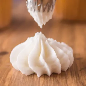 A swirl of piped vanilla frosting