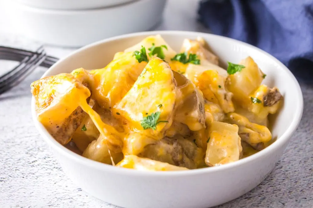 The best cheesy potatoes ever in a bowl.