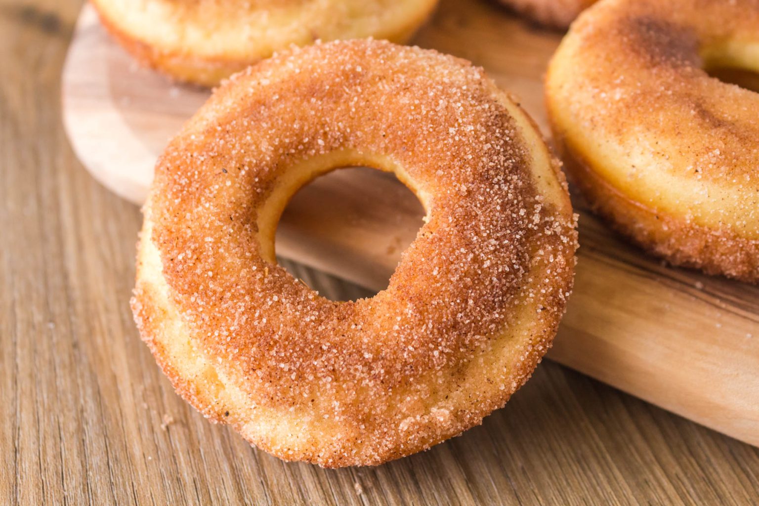 Close-up of one sourdough donut on a counter.