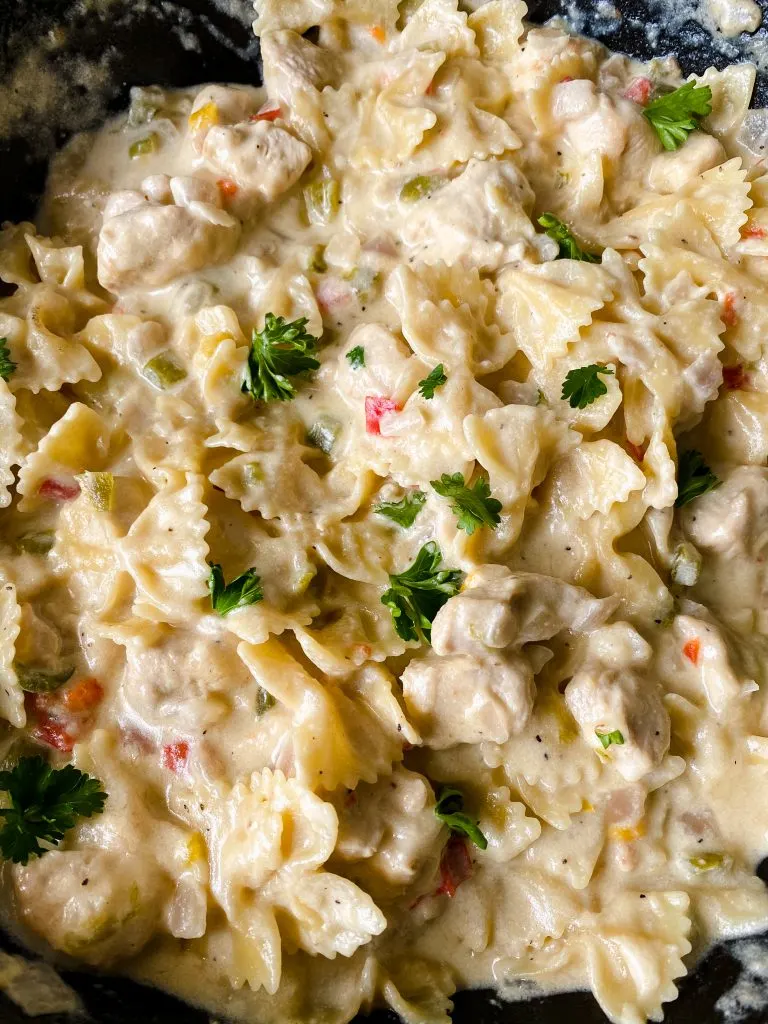 Bow tie parmesan chicken in a skillet