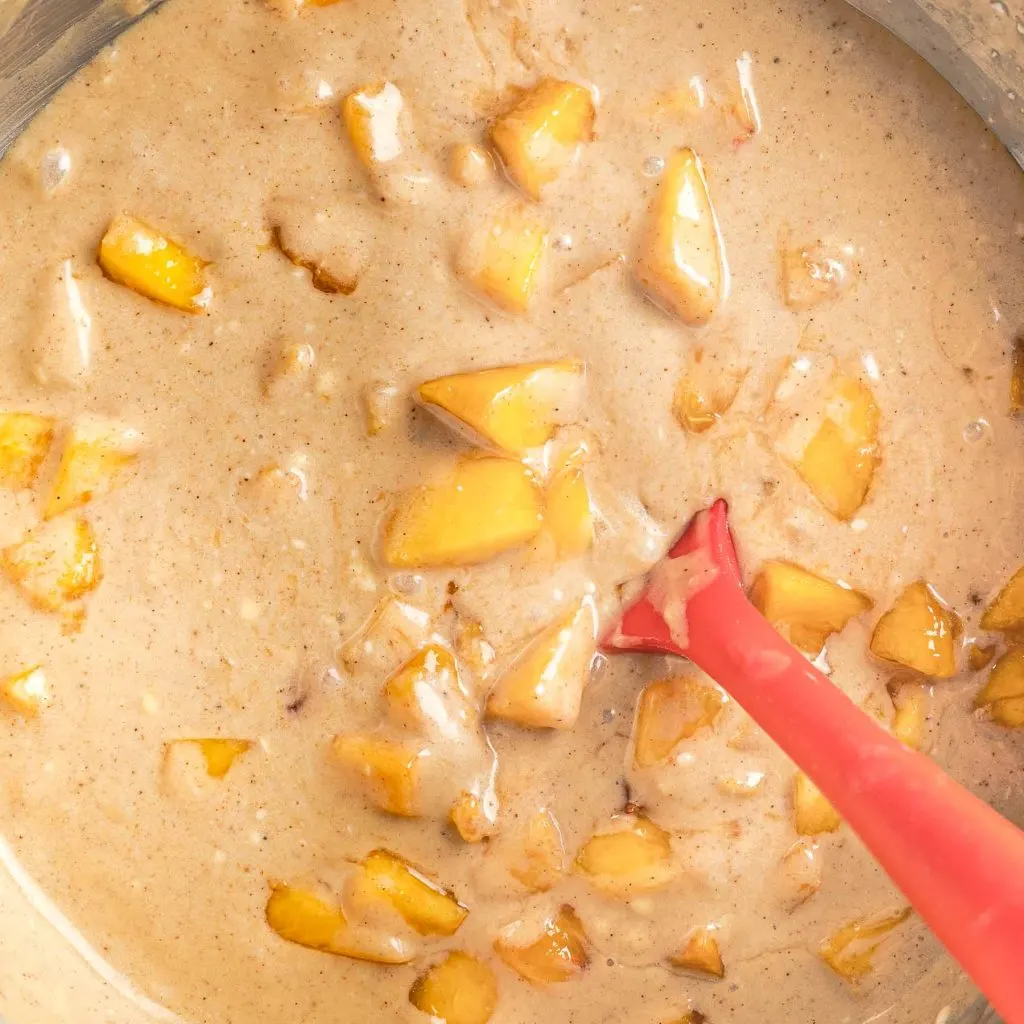 Peach cake batter in a bowl.