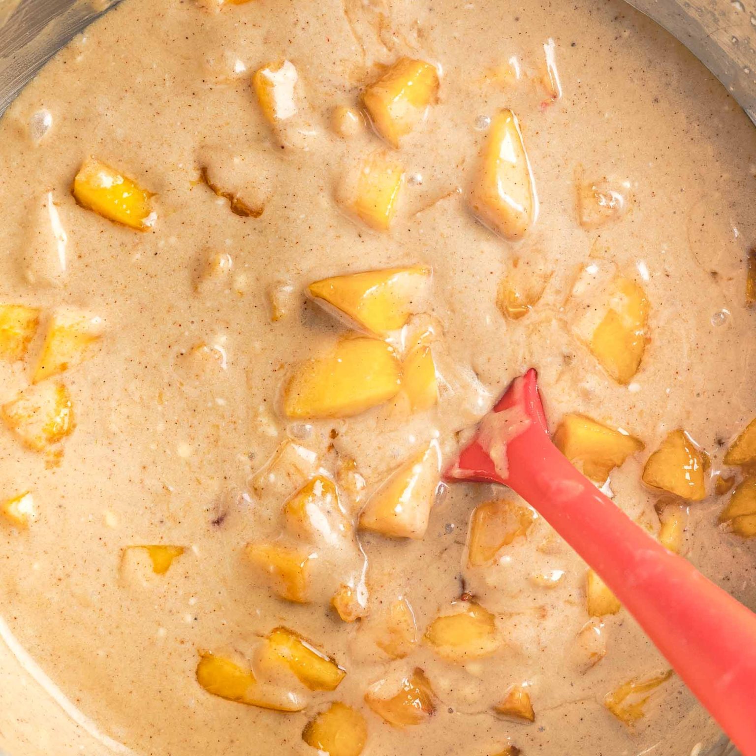 Peach cake batter in a bowl.