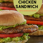 A balsamic marinated chicken breast sandwich topped with avocado and tomato.