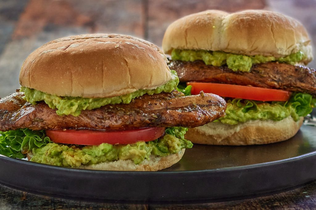 Close-up side view of two Balsamic Chicken Sandwiches.