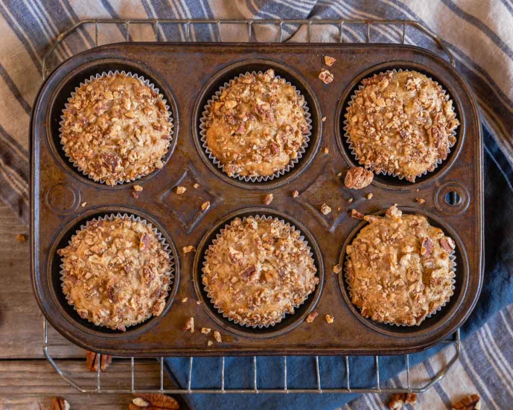 Top down view of healthy banana nut muffins sitting in a muffin tin