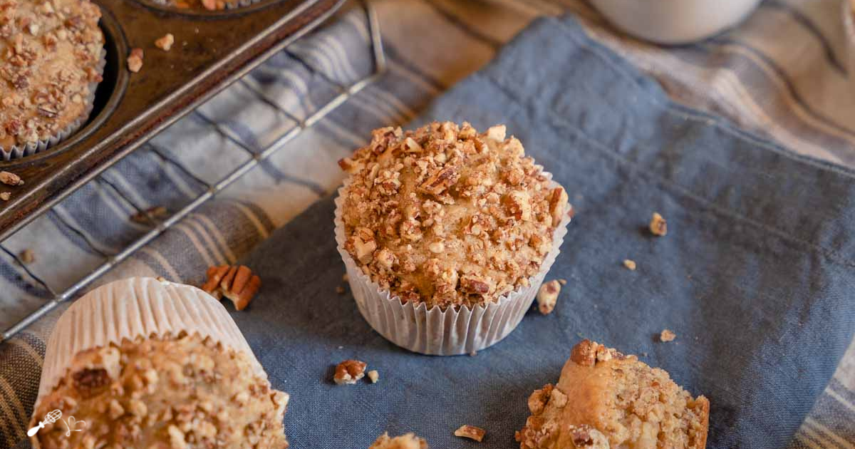 Top down view of a banana muffin topped with nuts