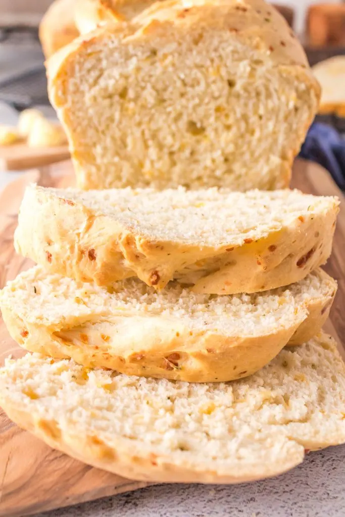 Three slices of loaf of cheesy bread.