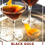 A side view of two Black and Gold Whiskey Cocktails