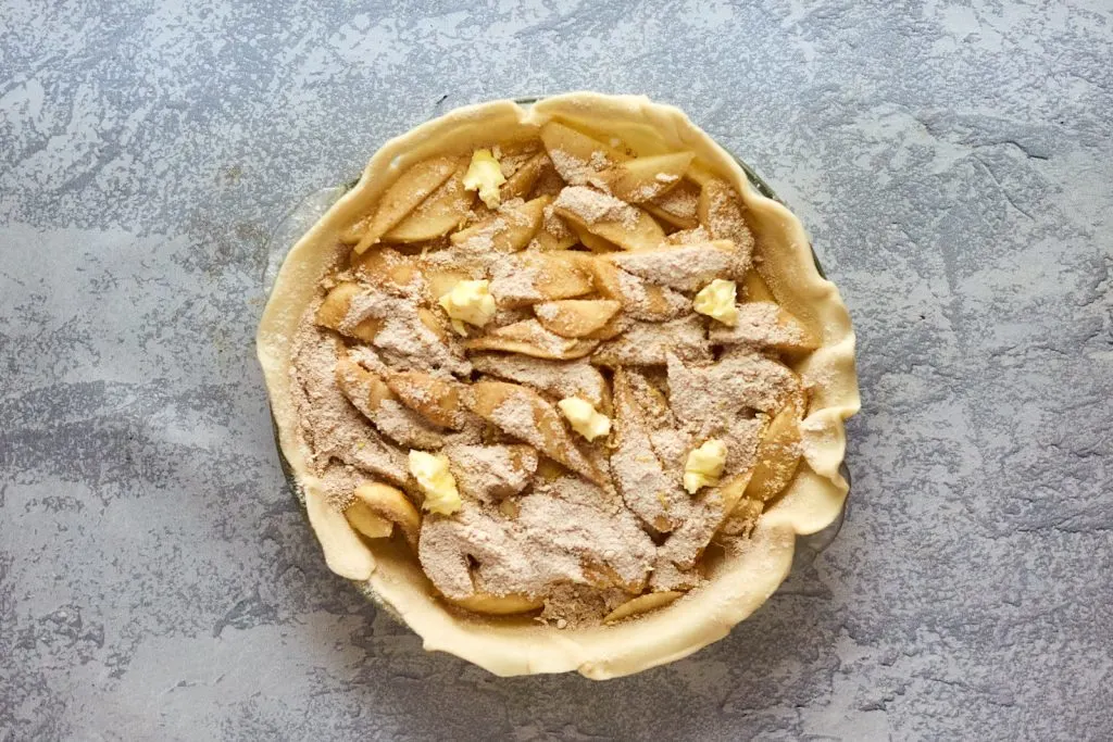 Top down view of pear pie filling layered in a homemade crust