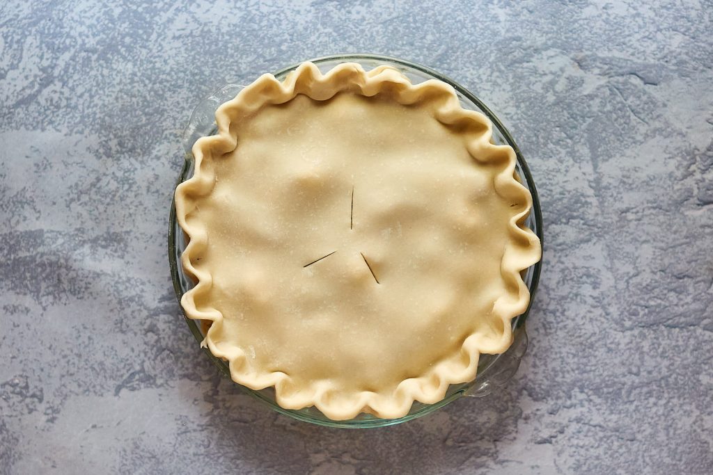 Top down view of an unbaked pearpie.