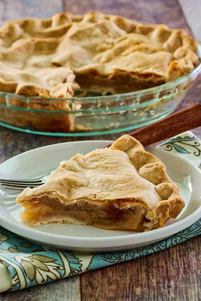 Close-up of single slice of fresh pear pie.