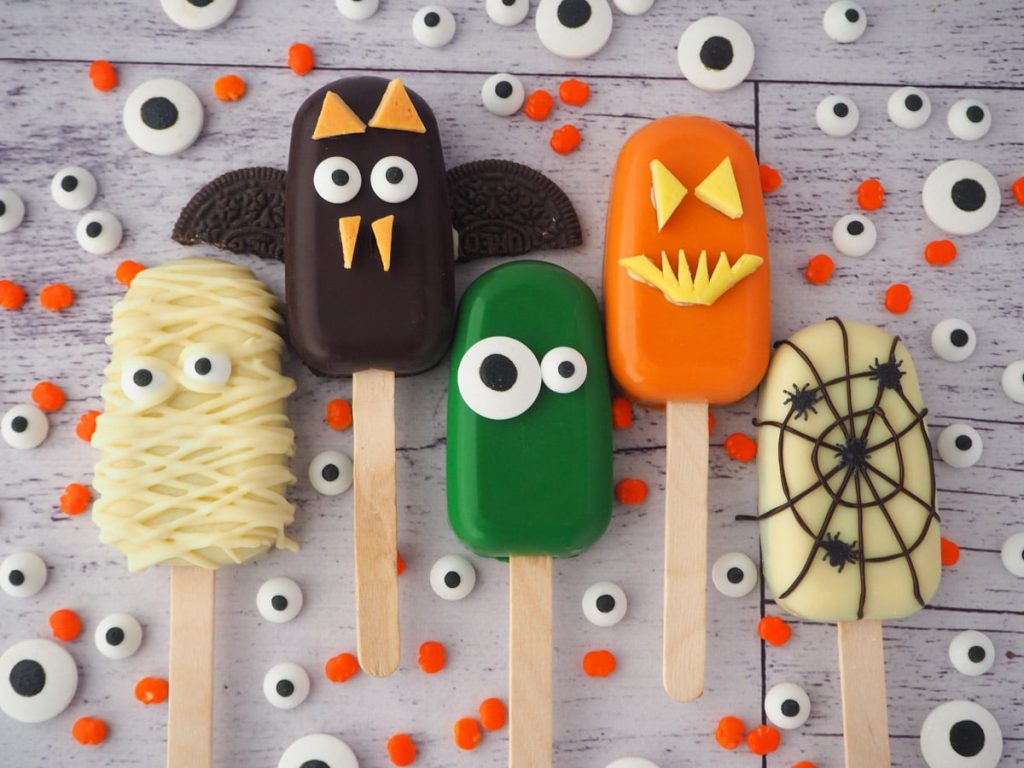 Cakes shaped like popsicles for Halloween.