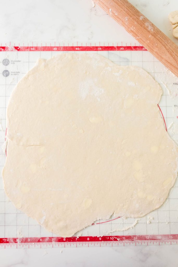 Rolled pie crust without shortening on a pastry matt