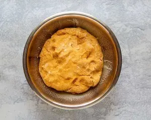 Pumpkin bread dough in a bowl - Hostess At Heart