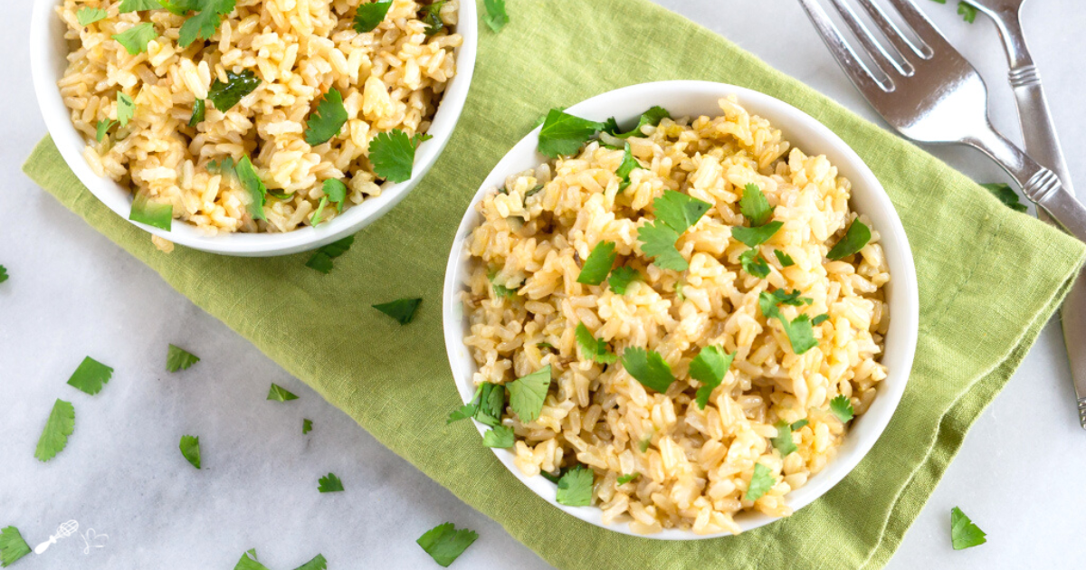 Top view of two bowl of instant pot tomatillo rice topped with cilantro