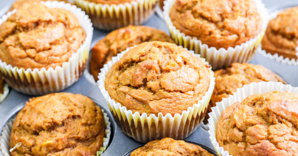 Angled overview of several banana pumpkin muffins that are soft, tender and easy to make. Hostess At Heart