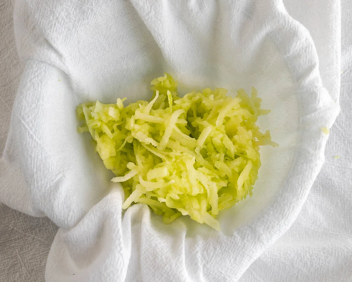 Shredded apple in a tea towel