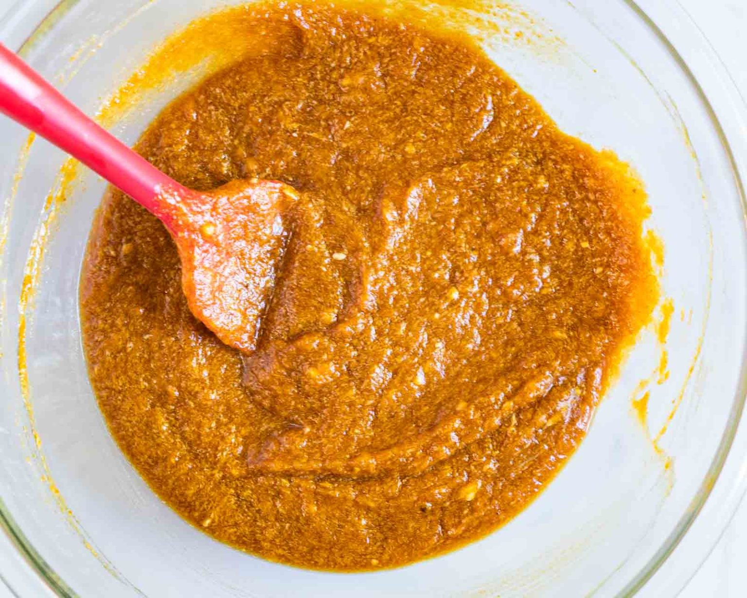 Bowl of mixed pumpkin batter for muffins.