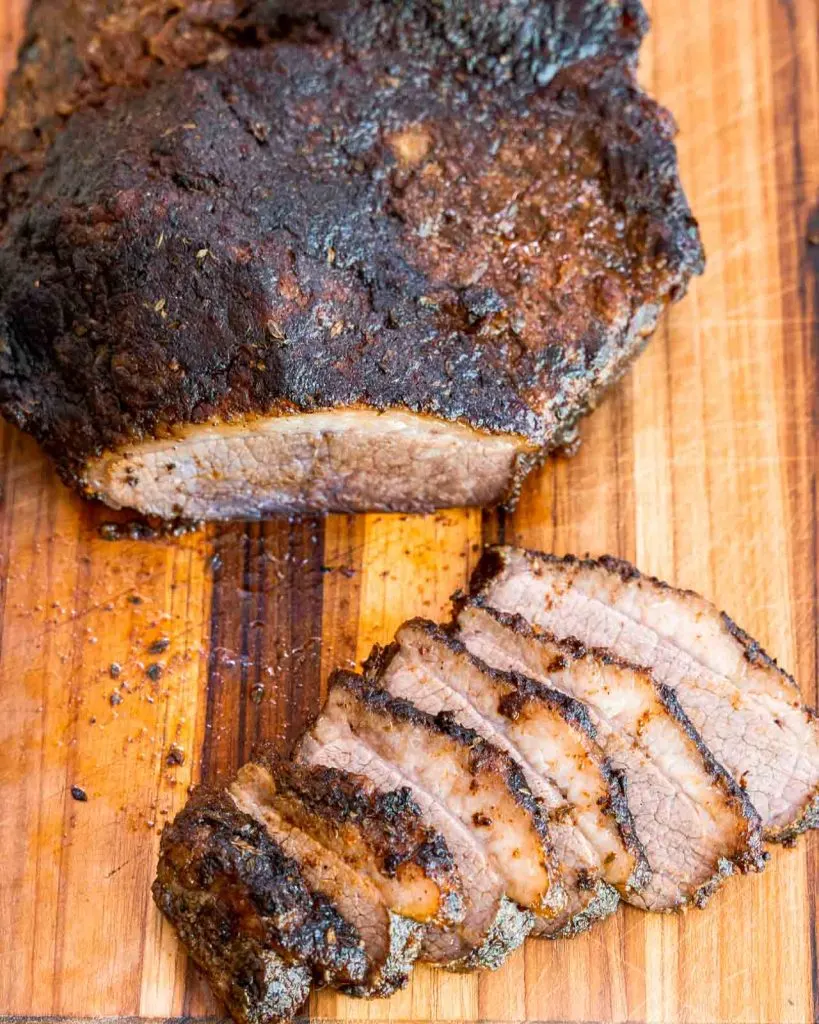 Top down view of a baked and sliced brisket.