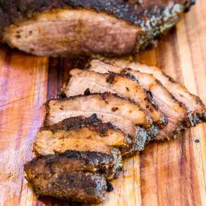 Front image of an oven brisket recipe that was dry rubbed creating a crusty bark and juicy beef.