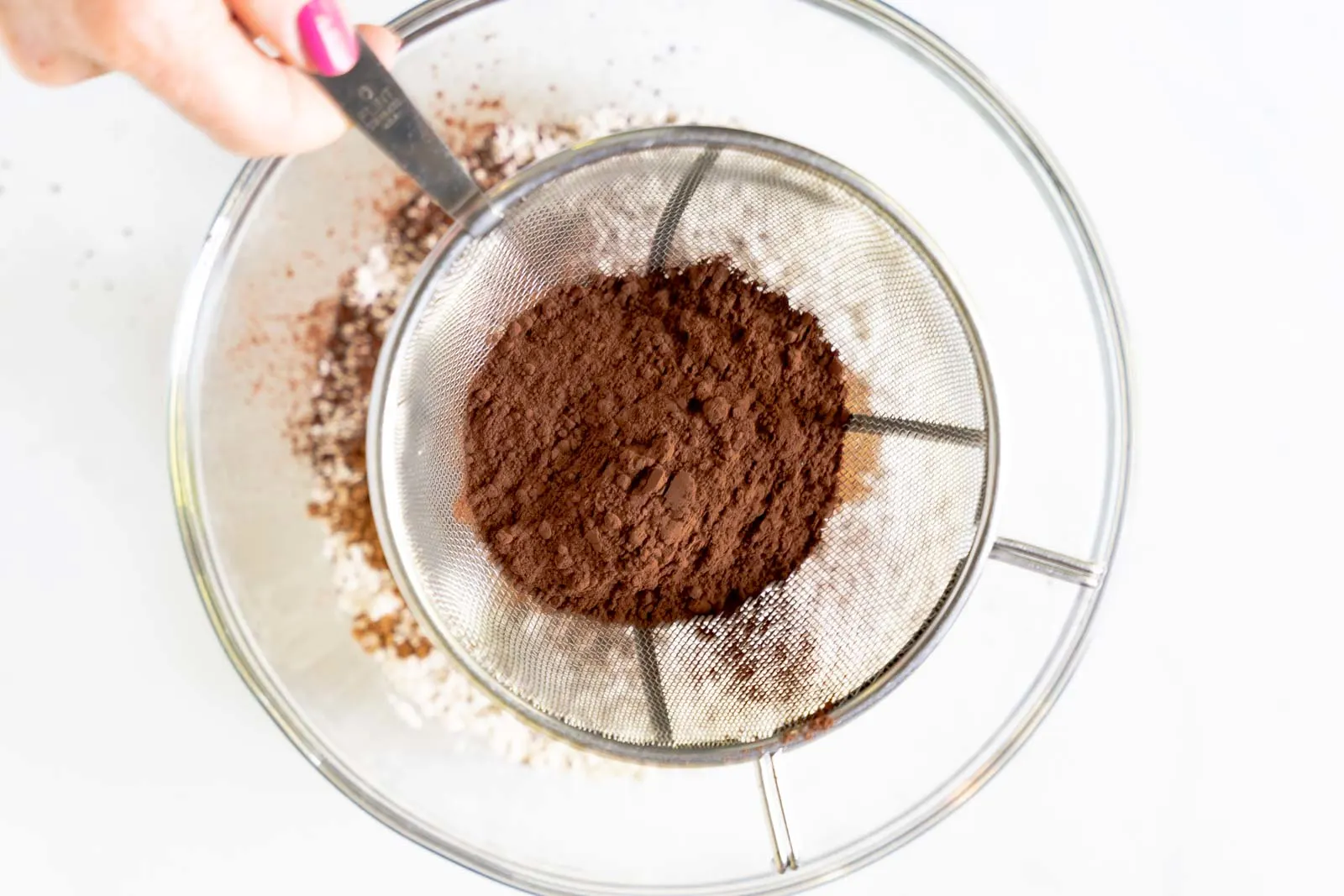 top down view of cocoa being sifted.