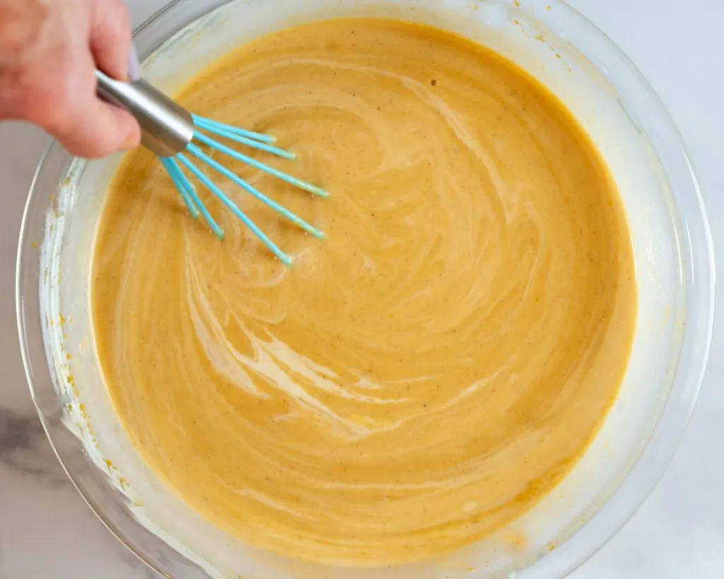 Top down view of pumpkin pie filling mixed until creamy.