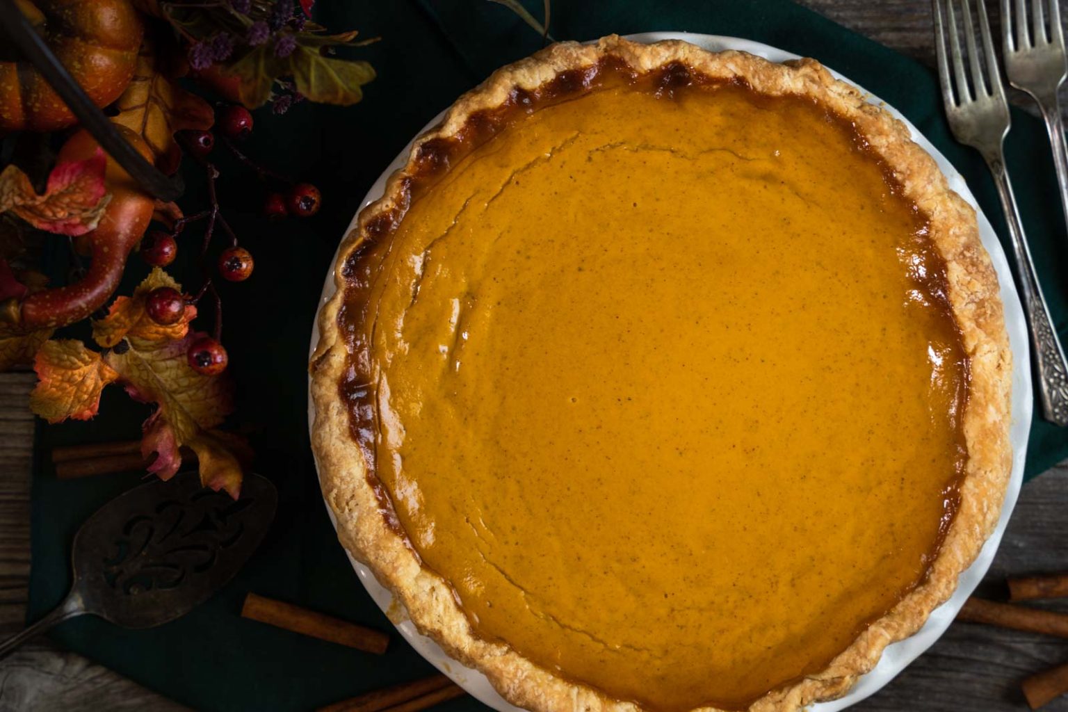 Top down view of a whole pumpkin pie baked from scratch.