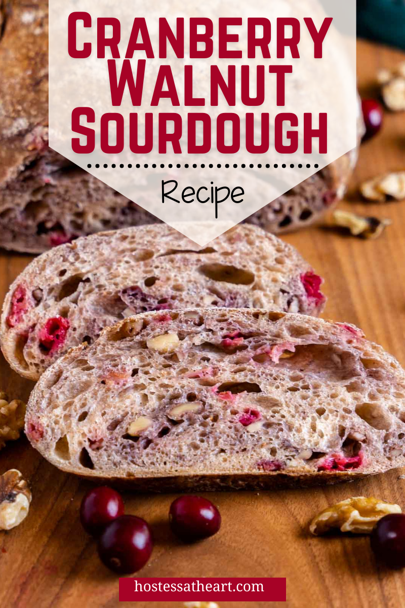 A sliced loaf of Sourdough filled with fresh cranberries and walnuts.