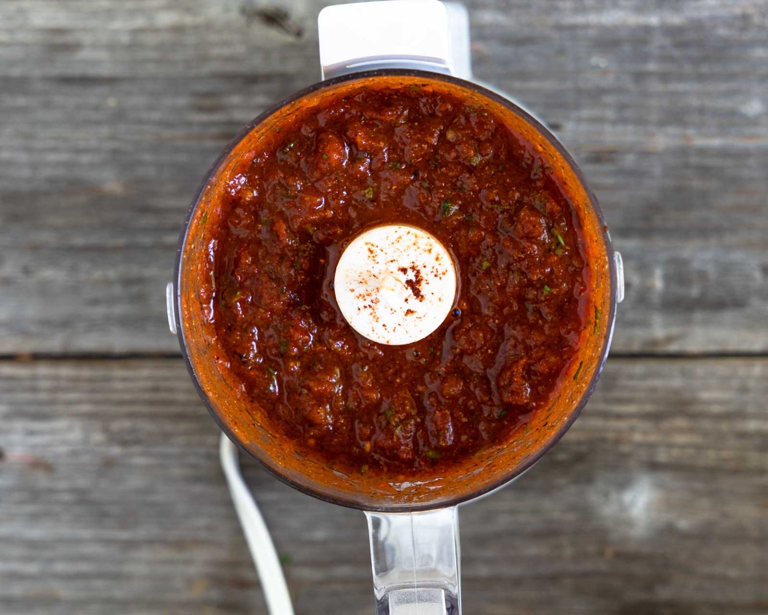Blended ingredients in a food processor to made chipotle sauce.