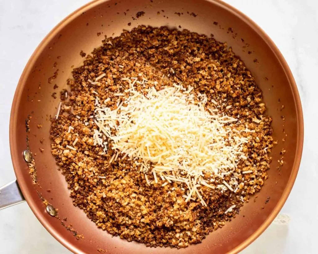 Toasted bread crumbs topped with parmesan cheese.