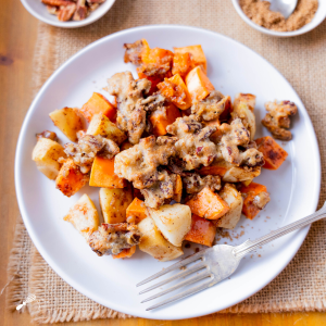 Top down view of diced sweet potatoes and apples in a brown sugar and pecan sauce.