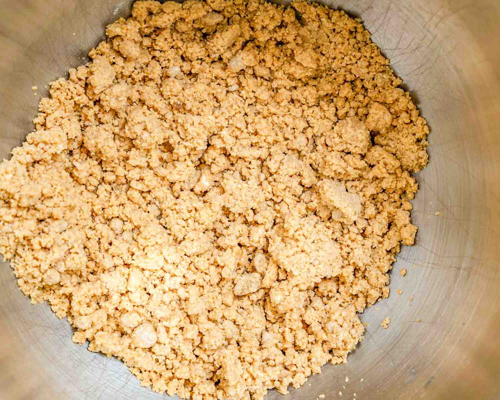 Crumbled peanut butter topping for a peanut butter cream cheese dessert.