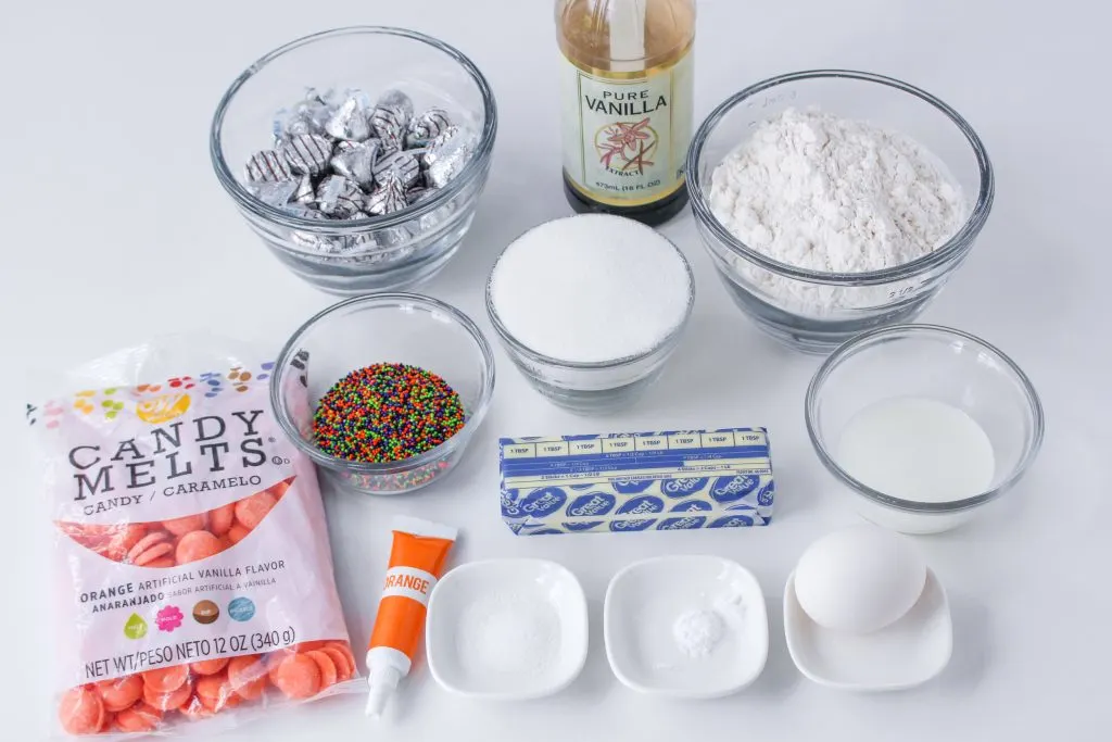 Ingredients: flour, sugar, salt, sprinkles, butter, milk, vanilla, candy melts, orange food coloring, eggs, baking soda.