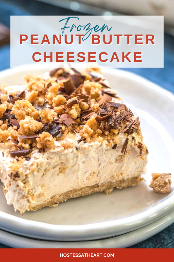 A serving of a frozen peanut butter cheesecake topped with crumble and chocolate shavings.