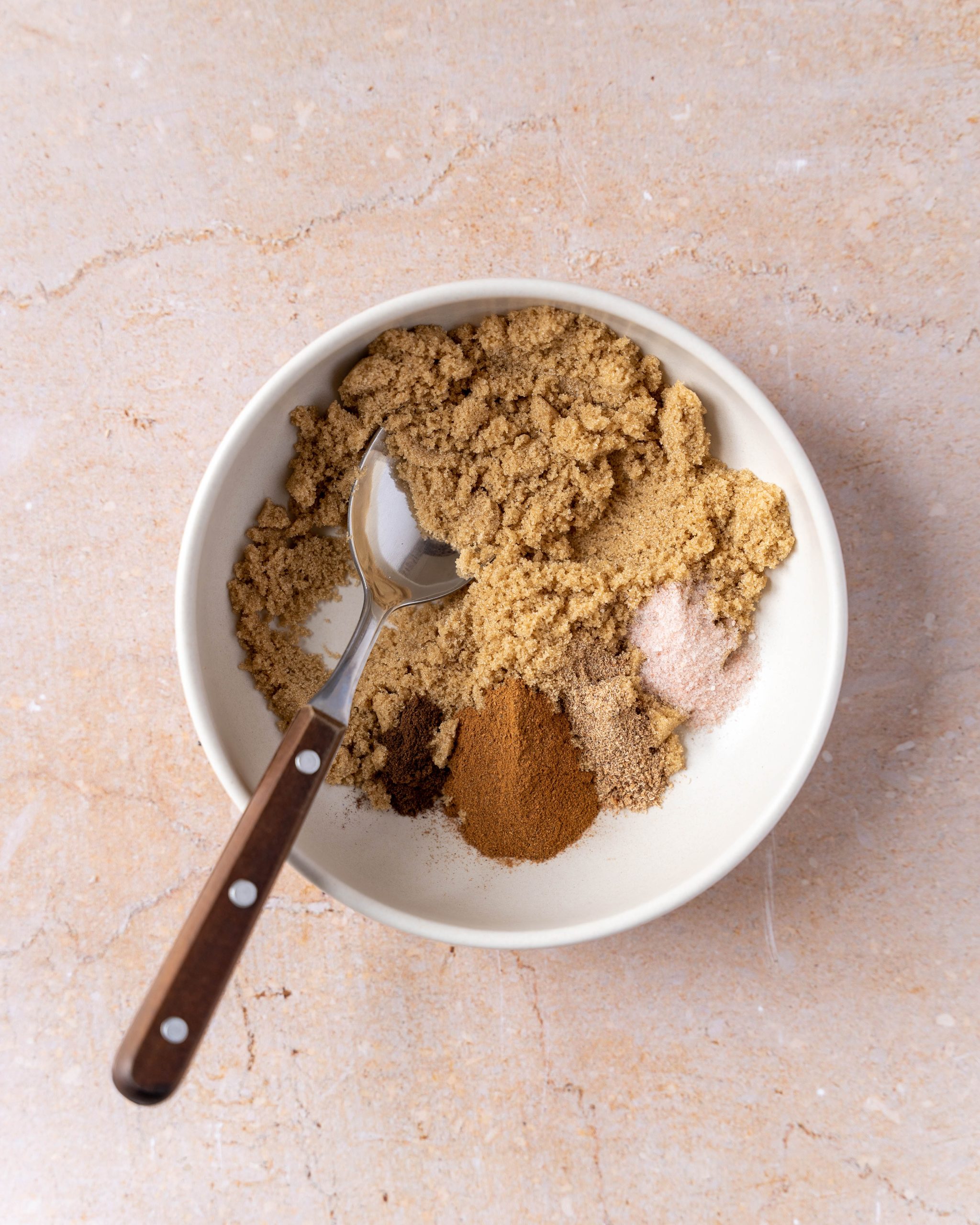 A bowl filled with brown sugar and spices