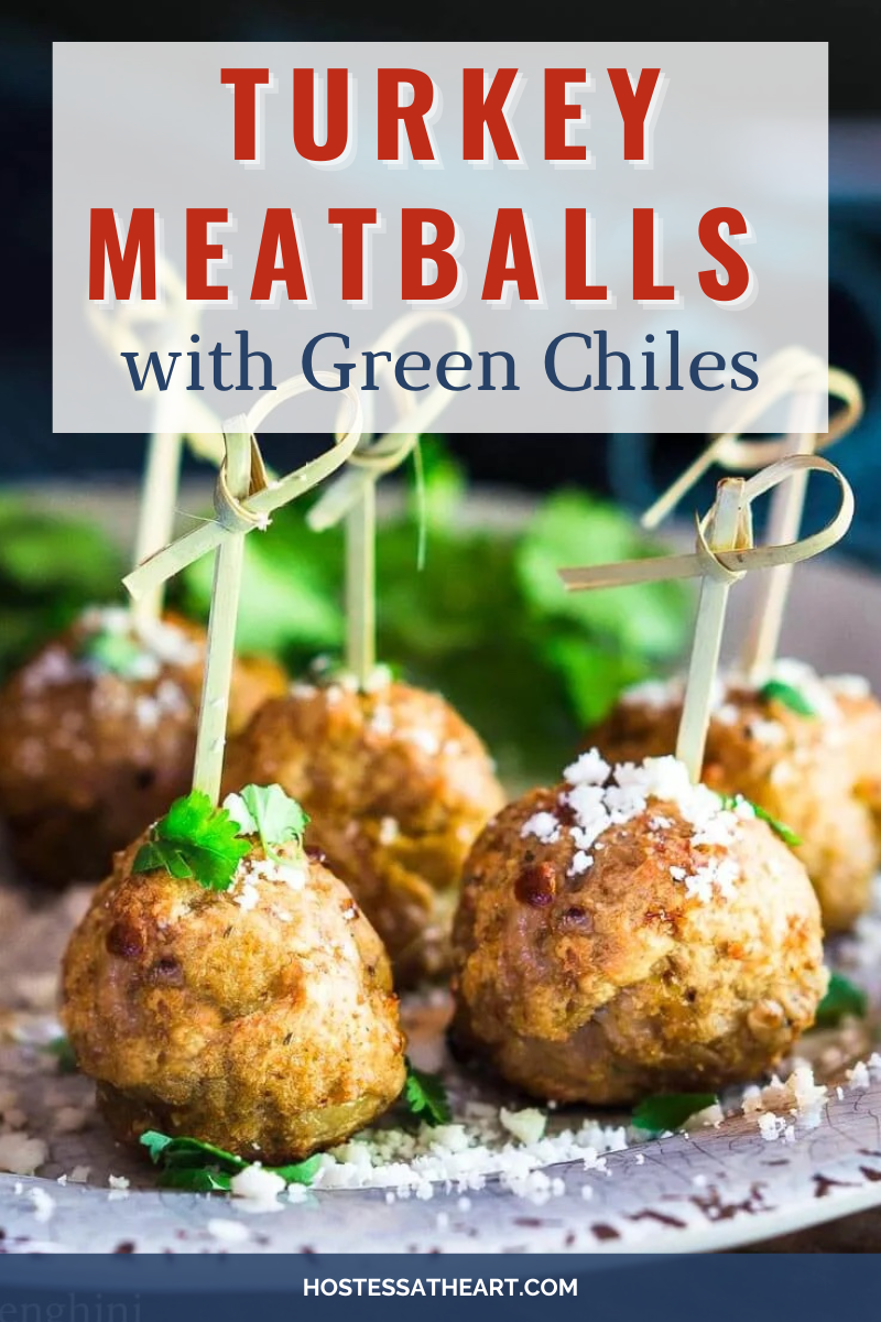 Side view of meatballs made from ground turkey and green chiles garnished with cilantro and cotija cheese.
