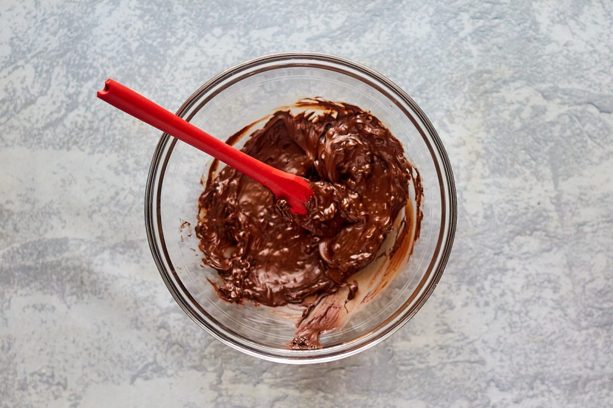 A bowl filled with thick chocolate mousse filing.