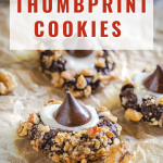 Table view of a thumbprint cookie with chocolate kisses and rolled in nuts.